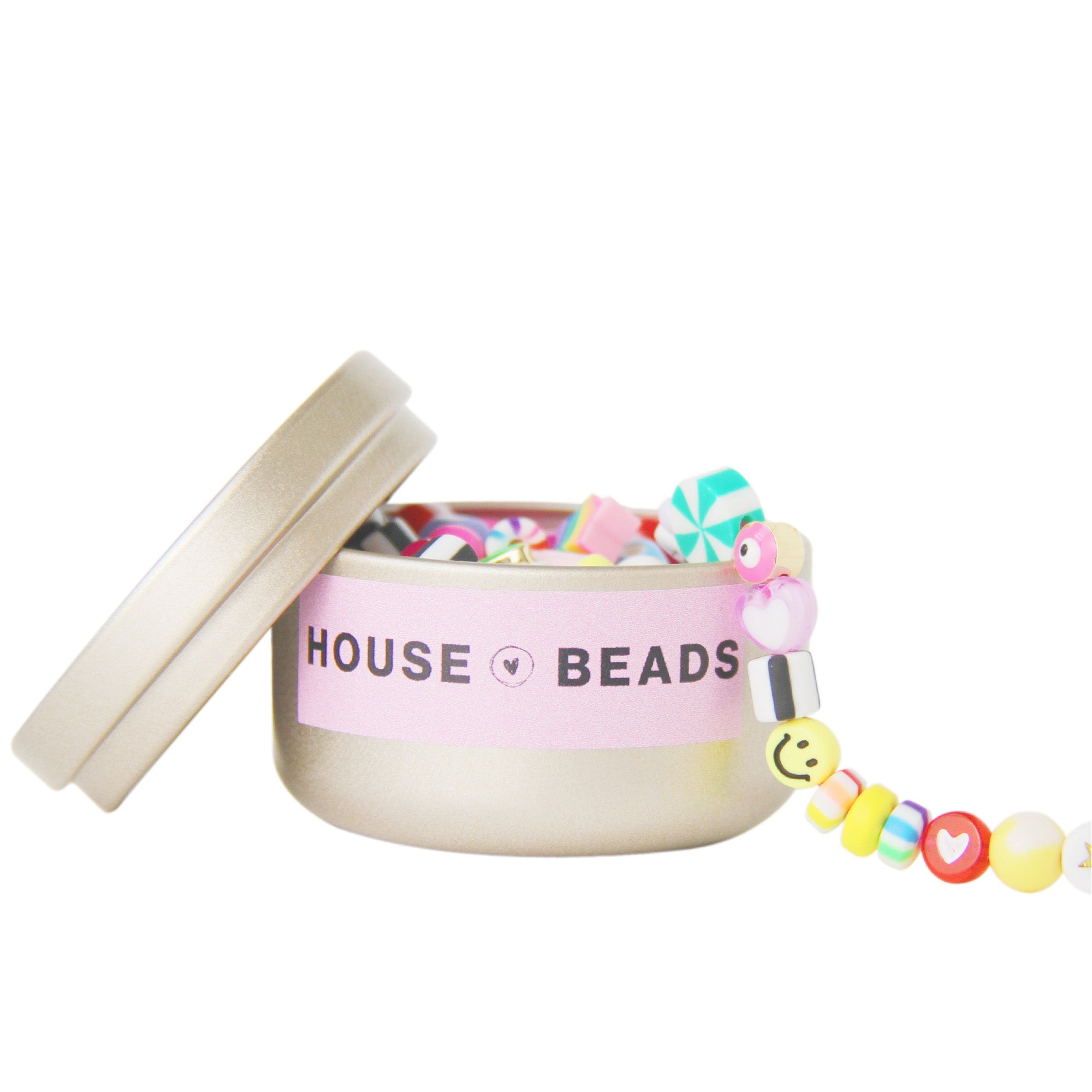 Gold tin containing a selection of pick and mix colourful beads on a white background with House of Beads branding