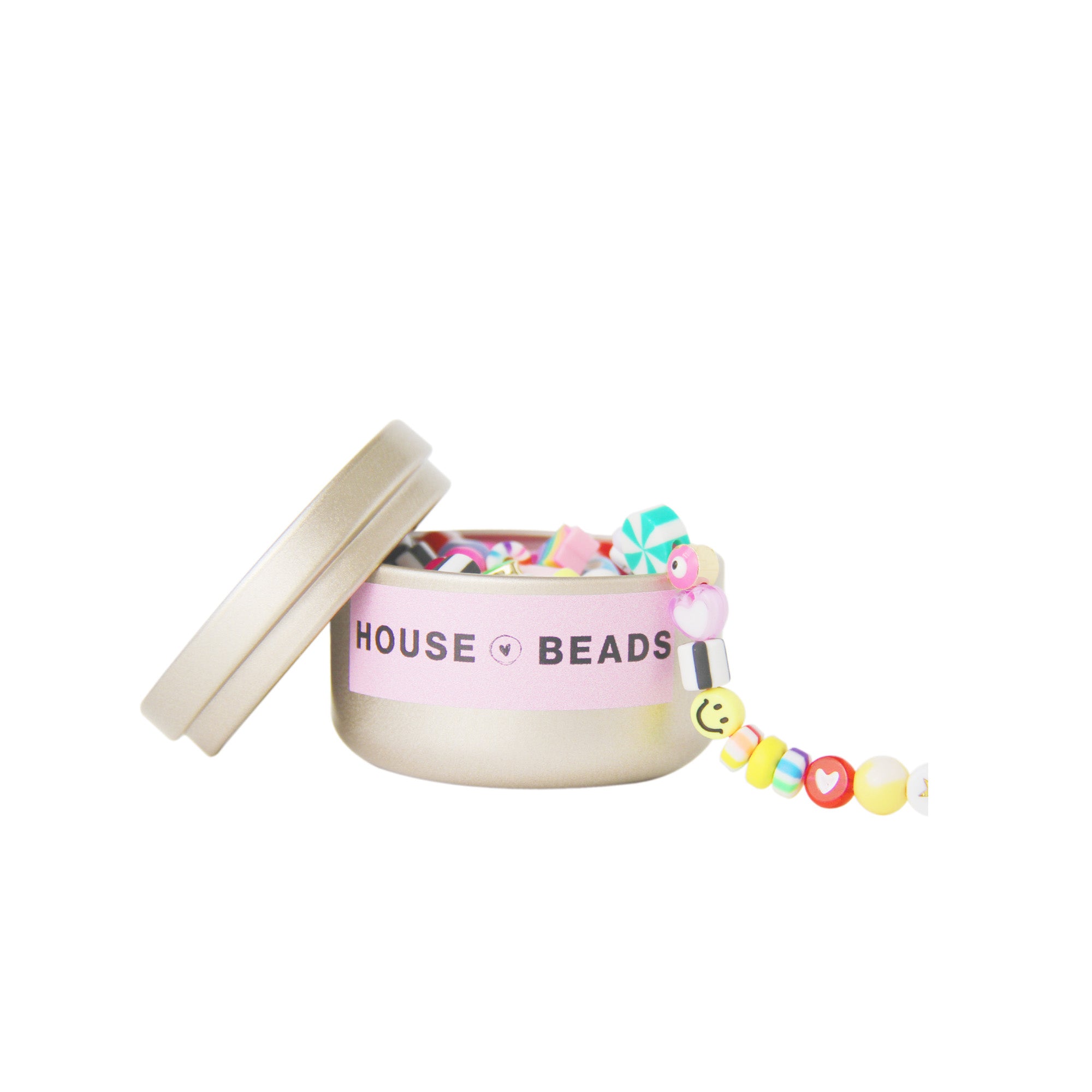 Gold tin containing a selection of pick and mix beads with House of Beads branding on it